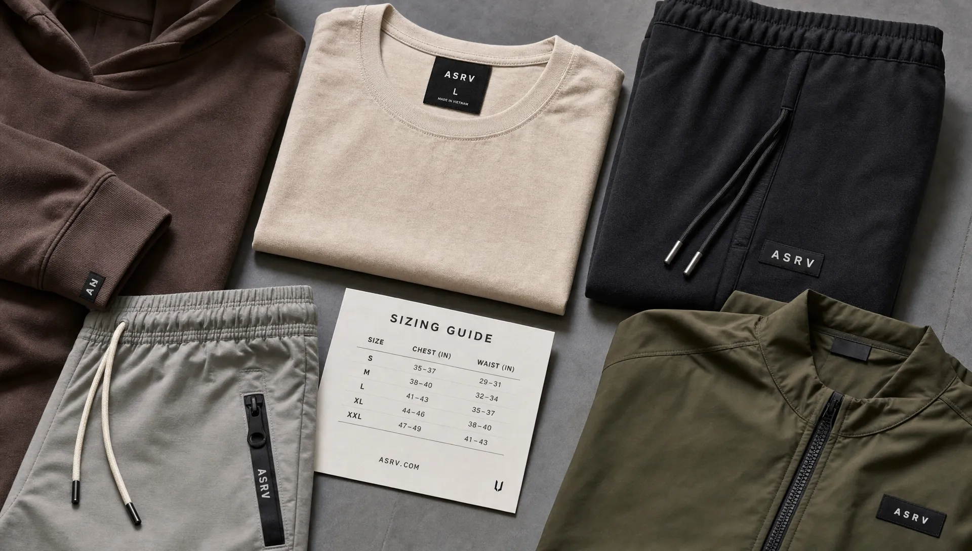 A flat lay of a heavyweight tee, joggers, hoodie, shorts, and jacket shows a cohesive lifestyle sportswear capsule.
